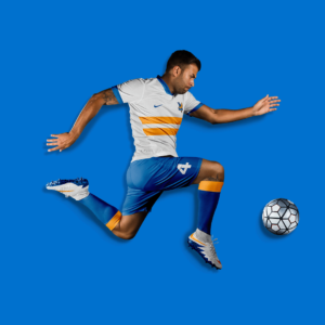 Soccer player wearing Morales Macaws team uniform in front of blue background. Click to see project.